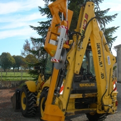 Pruning equipment on excavator tractor New Holland